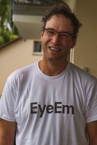 Portrait of smiling man standing at home