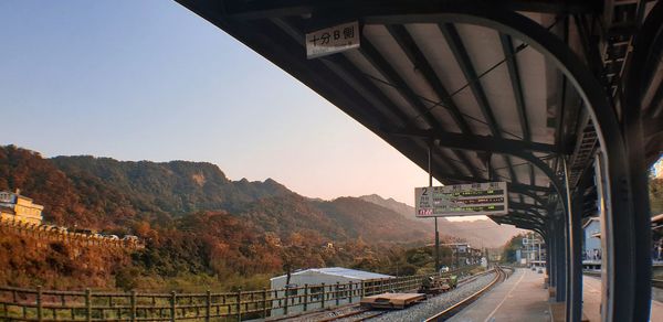 Bridge over road against sky