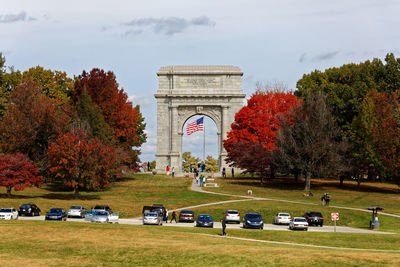 Cars parked at park during autumn