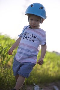 Full length of boy standing on field