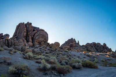 Rock formations in desert landscape against clear sky