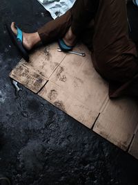 High angle view of mechanic working at auto repair shop