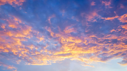 Low angle view of dramatic sky during sunset