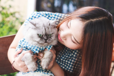 Portrait of cute girl with cat