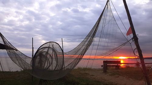 Ferris wheel against sky during sunset