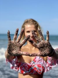 Portrait of a girl with outstretched palms