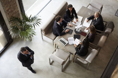 Team of financial advisors planning with business coworkers during meeting at law firm