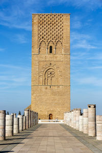 Hassan tower against blue sky