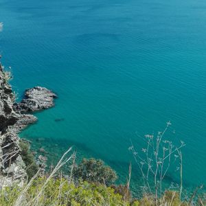 High angle view of sea against blue sky