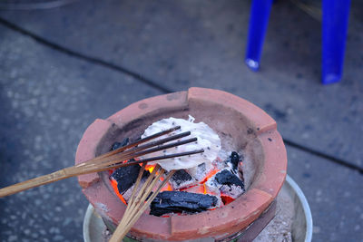 High angle view of fire on barbecue grill