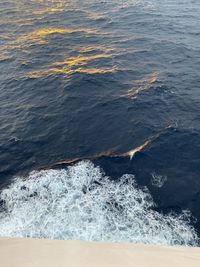 High angle view of waves splashing on shore