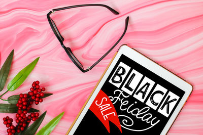 High angle view of heart shape on pink board