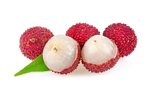 Close-up of fruits against white background