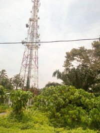 Low angle view of electricity pylon against sky