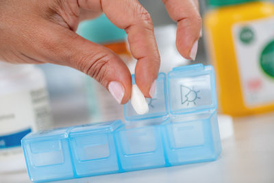 Cropped hand of person playing chess