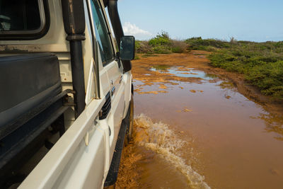 View of abandoned car on land