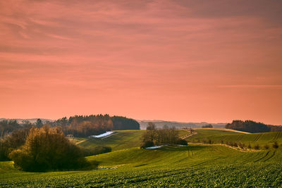 Scenic view of landscape against sky during sunset