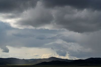 Storm clouds over landscape