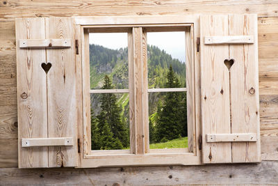 Closed window of abandoned house