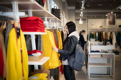 Woman standing in store for sale