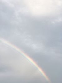 Low angle view of rainbow against sky