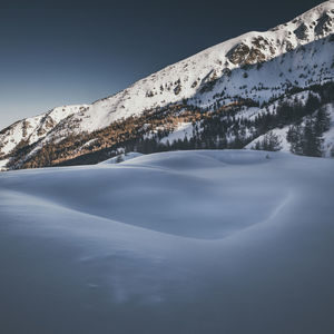 Snow covered mountain against sky