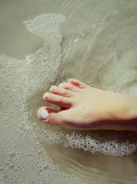 Woman standing in water