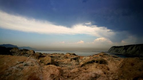 Scenic view of sea and rocks against sky