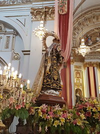 Low angle view of statue in illuminated building