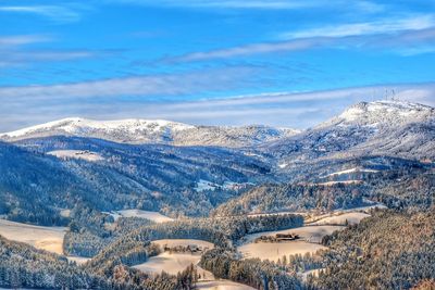 Scenic view of mountains against sky during winter