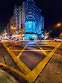 City street and modern buildings at night