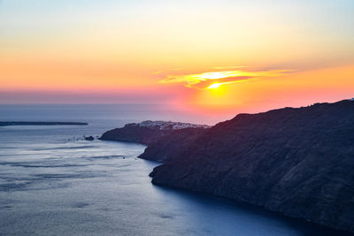 Scenic view of sea against romantic sky at sunset