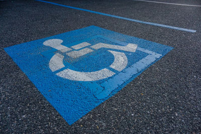 High angle view of handicap sign on road