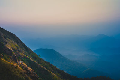 Scenic view of mountains against sky during sunset