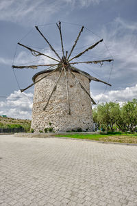 Traditional windmill against sky