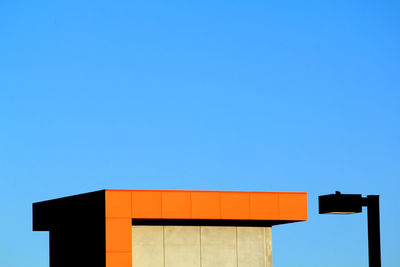 Low angle view of built structure against clear blue sky