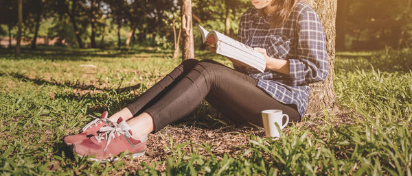 Woman sitting on field