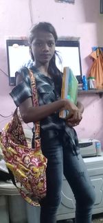 Portrait of a girl holding book