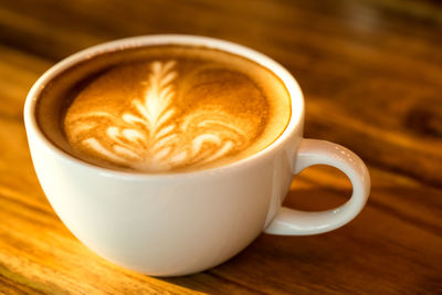 Close-up of cappuccino on table