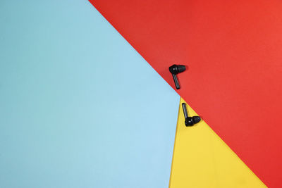 Low angle view of red wall against blue sky