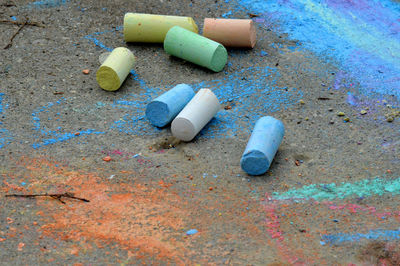 Close-up of colorful chalks on street