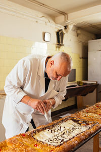 Midsection of man preparing food