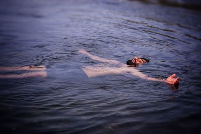 High angle view of man swimming in sea