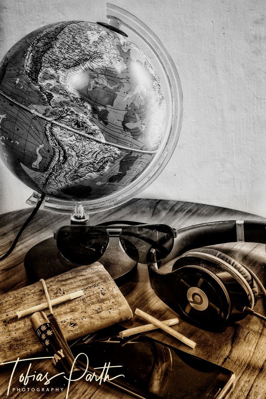 indoors, no people, close-up, still life, retro styled, machinery, household equipment, antique, old, transparent, metal, technology, glass - material, history, high angle view, glass, the past, equipment, directly above, wheel