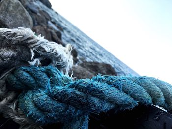 Close-up of fishing net against clear sky