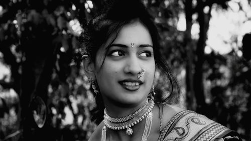 Portrait of smiling young woman outdoors