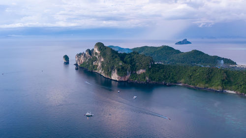 Aerial drone view of tropical ko phi phi island, and boats passenger in blue clear andaman sea 