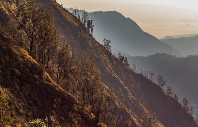 Scenic view of mountains against sky during sunset