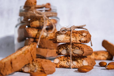 Traditional italian cantuccini cookies with almonds in glass jar. sweet dried biscuits. homemade 