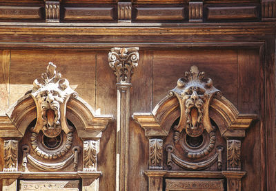 Ornate sculpture on wooden door